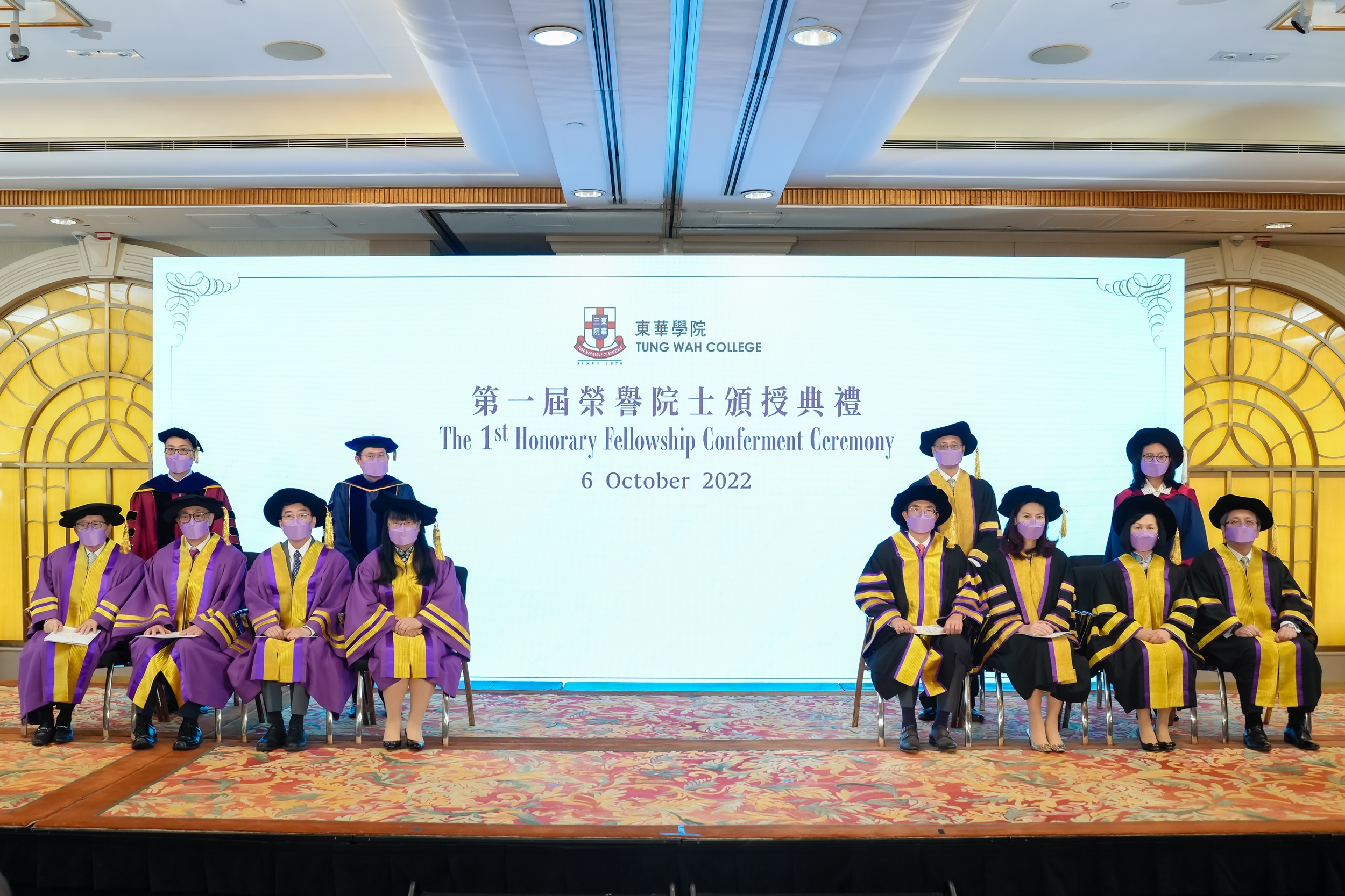 The ceremony is presided by Professor Alex CHAN Chi Keung, Dean of the School of Arts and Humanities of TWC (back row, left 1). Citation of the Honorary Fellowship recipients is delivered by Professor Lorna SUEN Kwai Ping, Dean of the School of Nursing (b