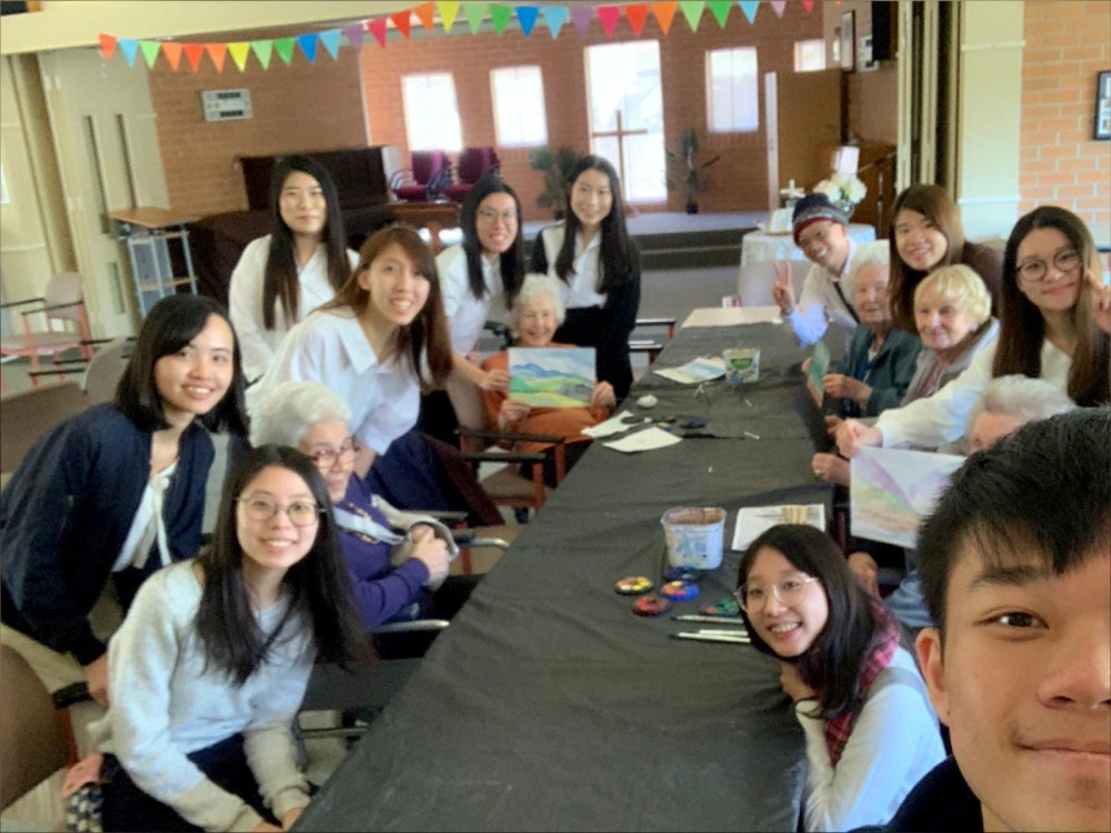 The older adults in Maroba lived happily with daily entertainment. They showed their beautiful drawings with big smiles.